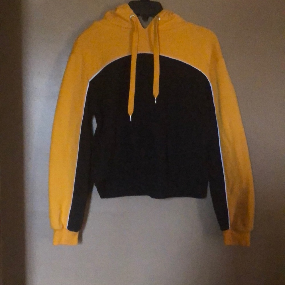 A Black And Gold Hoodie